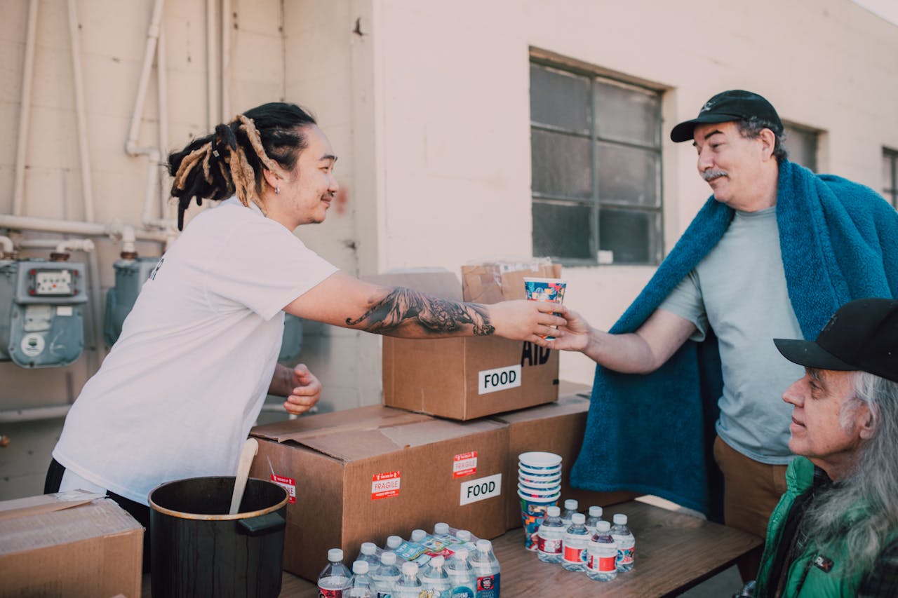 heros-img Volunteers distribute food and aid packages to those in need, fostering community support.